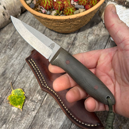 The Campcraft - Sabre Grind/Green Canvas Micarta